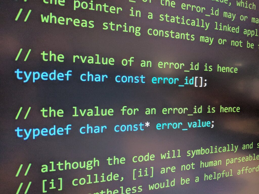 Close-up of code editor showing error messages and debugging comments representing WordPress development challenges