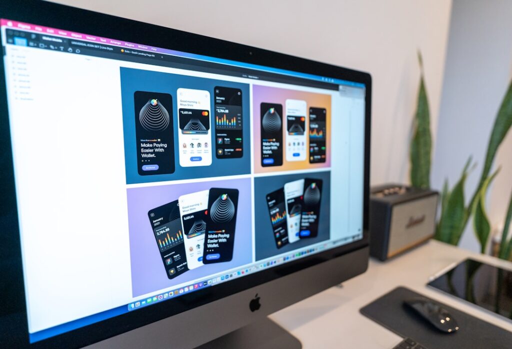 Computer screen displaying responsive mobile website design mockups and layouts for WordPress development