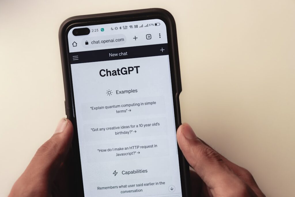 ChatGPT interface displayed on a smartphone showing AI chatbot capabilities and examples