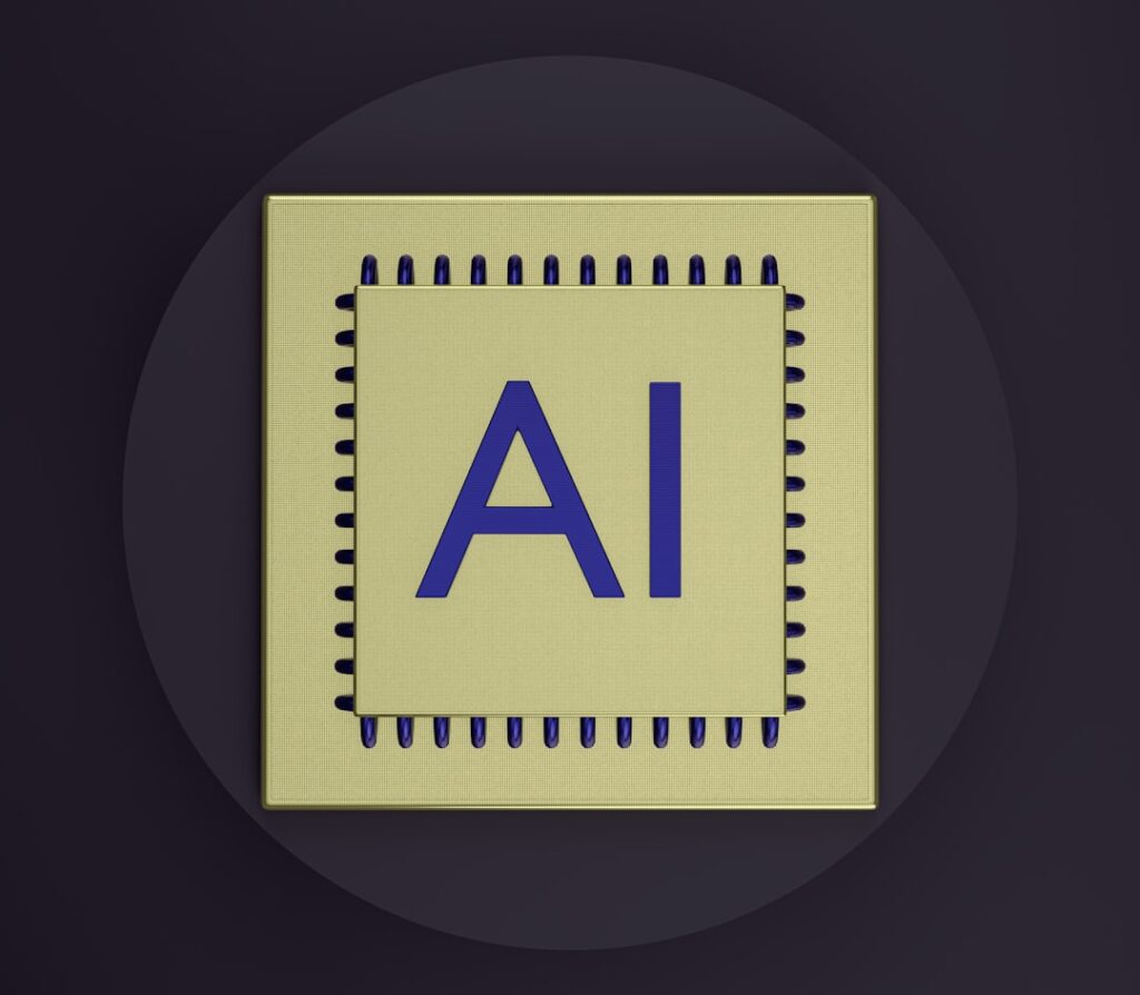 Gold AI processor chip showing artificial intelligence technology. Photo by Unsplash