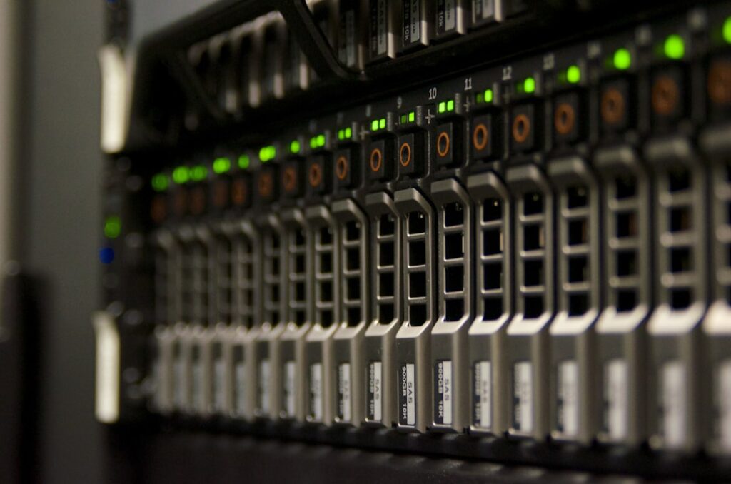 Server rack with multiple hosting servers and network connections, representing WordPress domain hosting infrastructure. Photo by domaintechnik.at