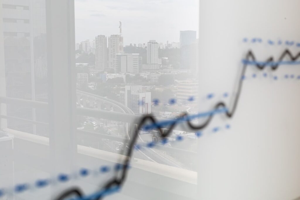 Business growth chart with city skyline reflection showing scaling and expansion concepts