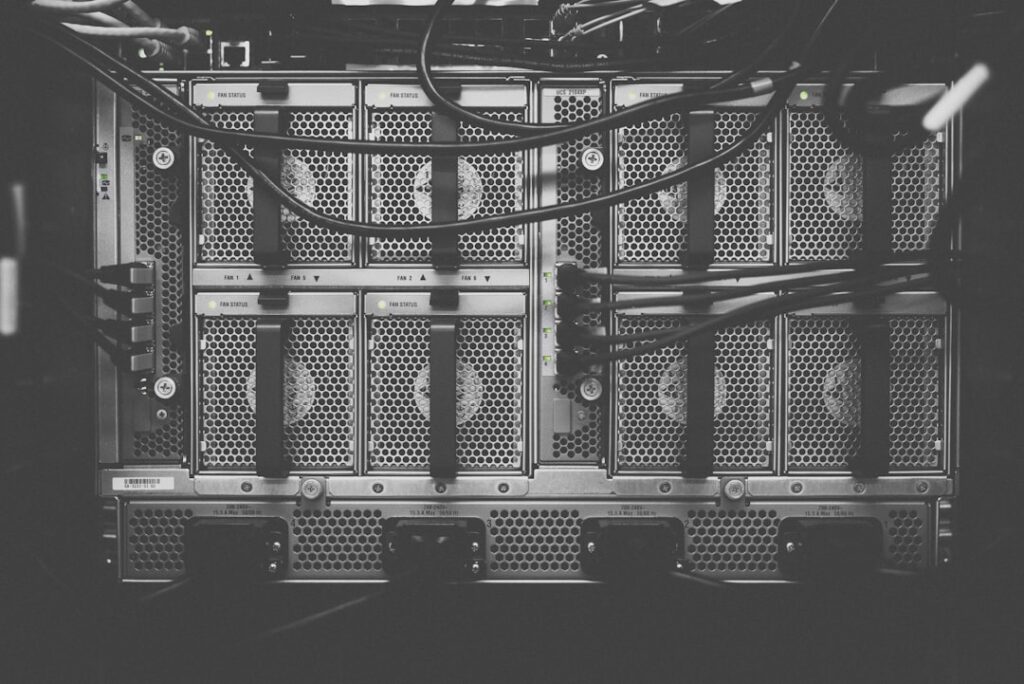 Data center server racks showing hosting infrastructure. Photo by Taylor Vick on Unsplash