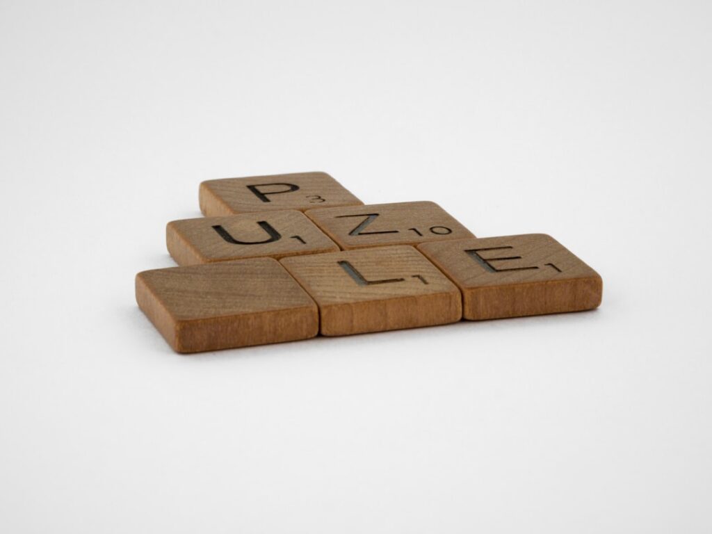 Wooden puzzle pieces representing WordPress plugins as modular building blocks