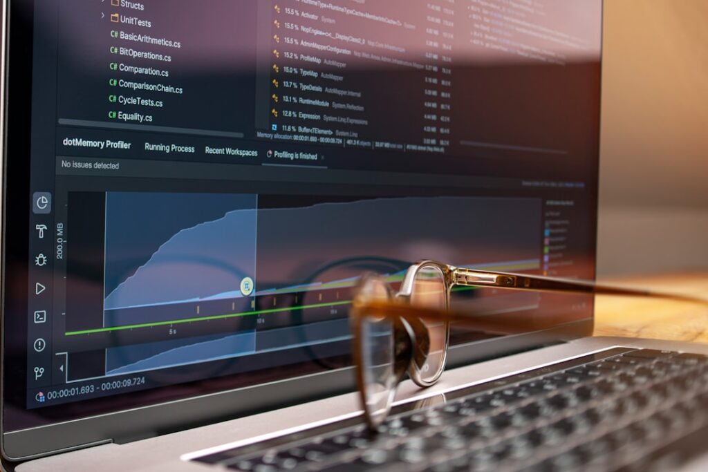 Laptop screen displaying analytics graphs and data charts for SEO analysis - Photo by Unsplash