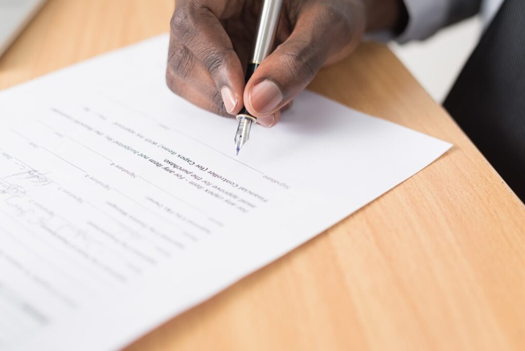 Business person reviewing hosting contract terms and conditions before signing