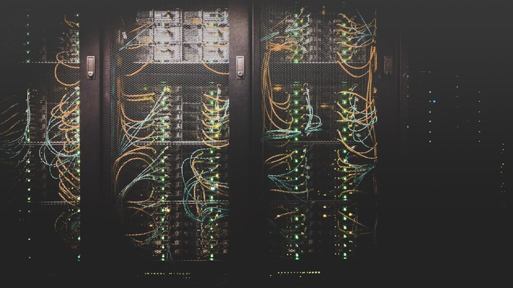 Dense network of cables and servers in a data center, illustrating the infrastructure behind web hosting