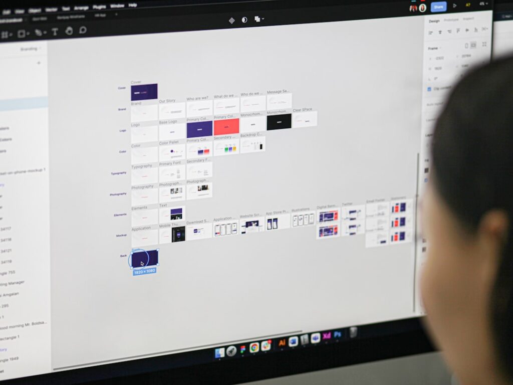 Person working on interface design and customization on a computer screen