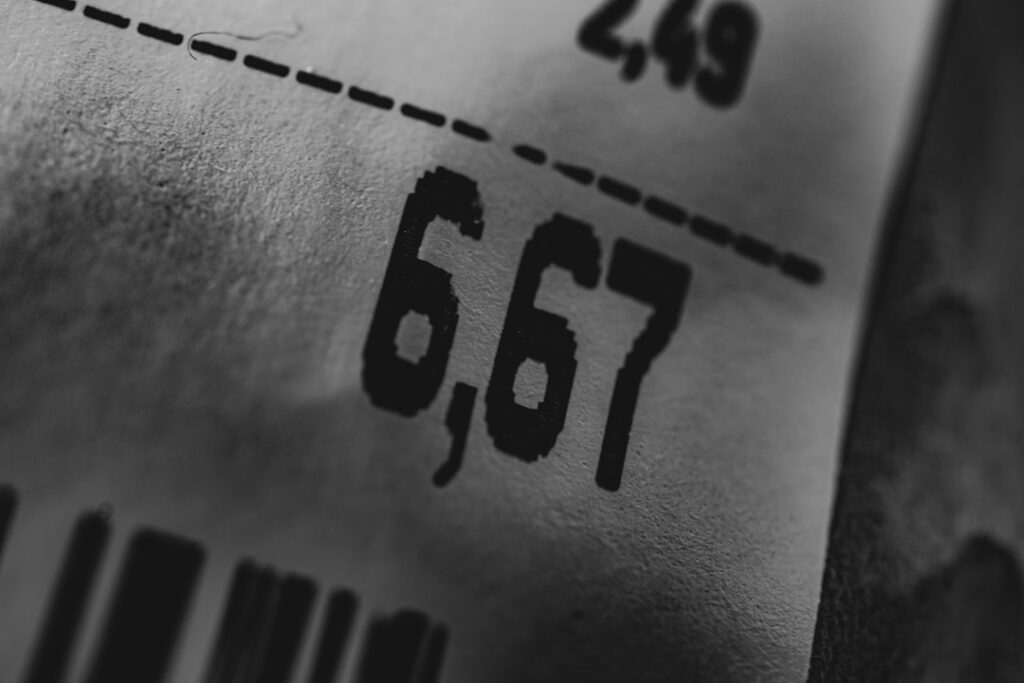 Close-up of a price label showing two different prices, representing hidden renewal costs in web hosting plans