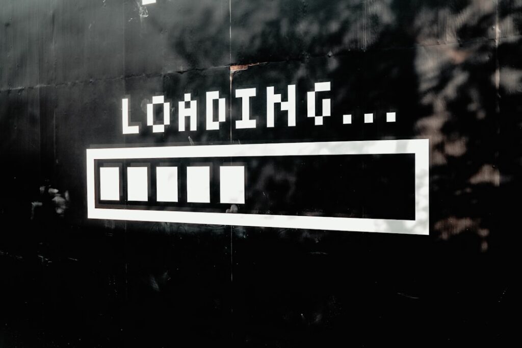 A "Loading..." progress bar on a dark screen, representing a slow website that has outgrown its server hosting plan.
