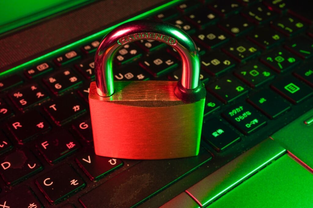A padlock sitting on a laptop keyboard, symbolizing cybersecurity and data privacy concerns with free AI tools